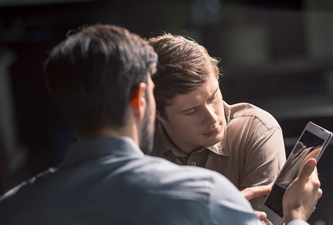 Two men sat talking